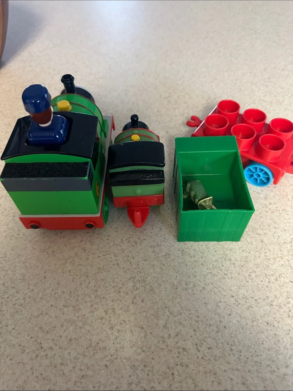 Green Percy the Small Engine toys and cargo cars from Thomas & Friends.